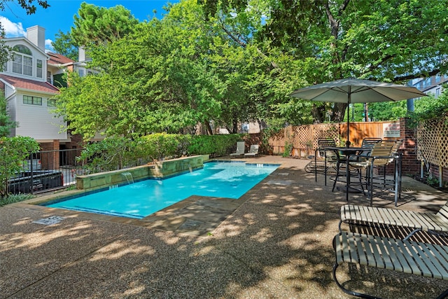 view of swimming pool with a patio