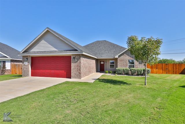 view of front facade featuring a front yard and a garage