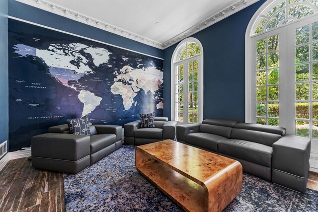 living room featuring crown molding and hardwood / wood-style floors