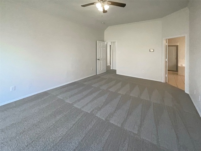 unfurnished room with dark carpet, vaulted ceiling, and ceiling fan