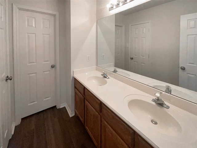 bathroom featuring hardwood / wood-style floors and vanity