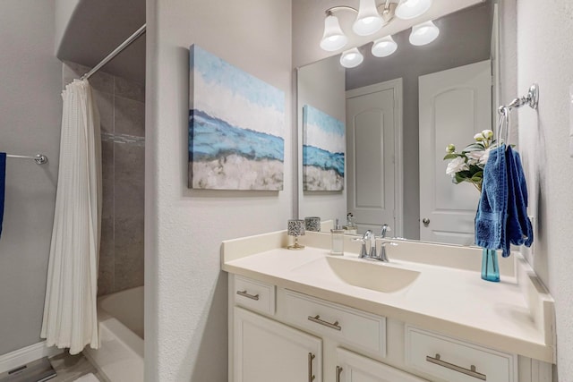 bathroom featuring shower / bath combo and vanity