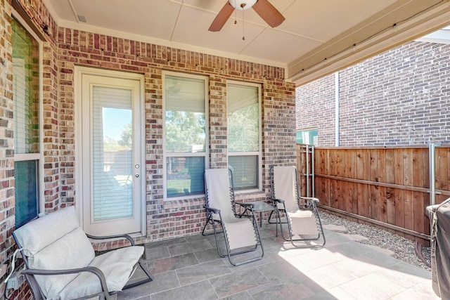 view of patio featuring ceiling fan