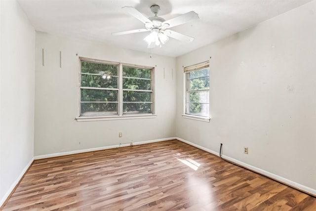 spare room featuring ceiling fan and light wood-type flooring