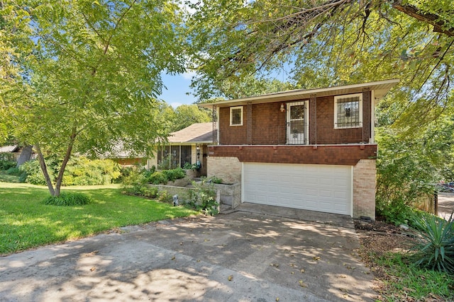 view of front of house featuring a garage and a front yard