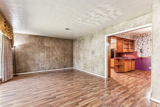 empty room with hardwood / wood-style flooring