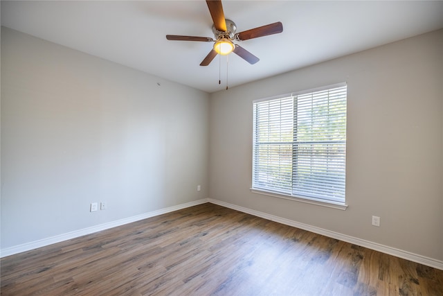 spare room with ceiling fan and hardwood / wood-style flooring