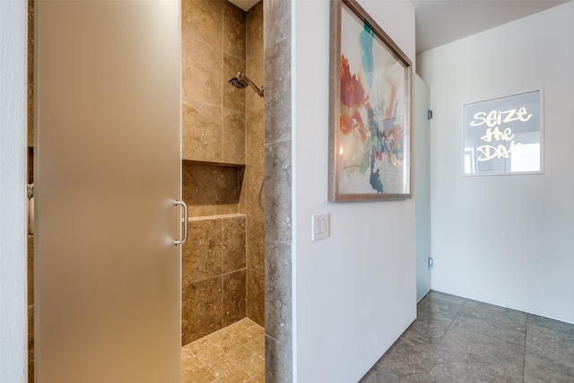 bathroom featuring a shower with door