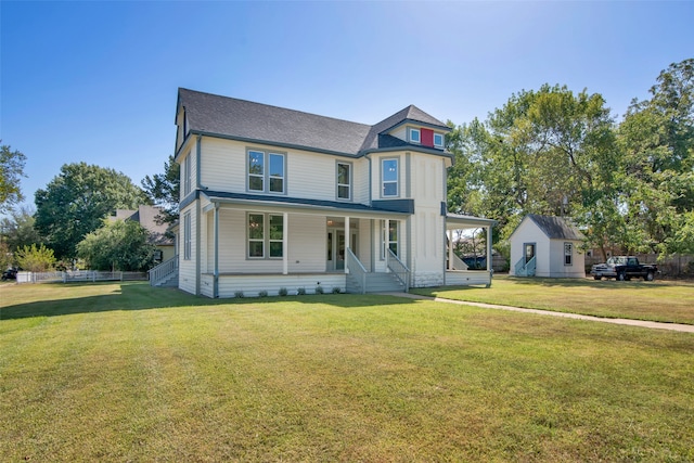 victorian house featuring a front lawn and covered porch