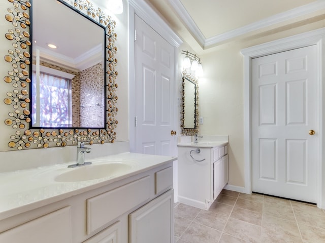 bathroom with ornamental molding, tile patterned flooring, and vanity