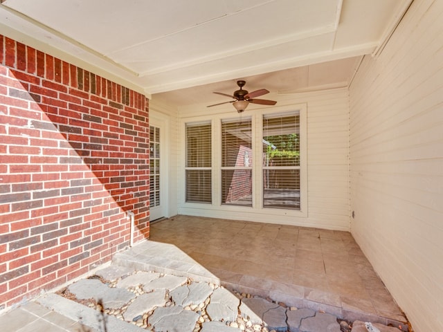 view of patio featuring ceiling fan