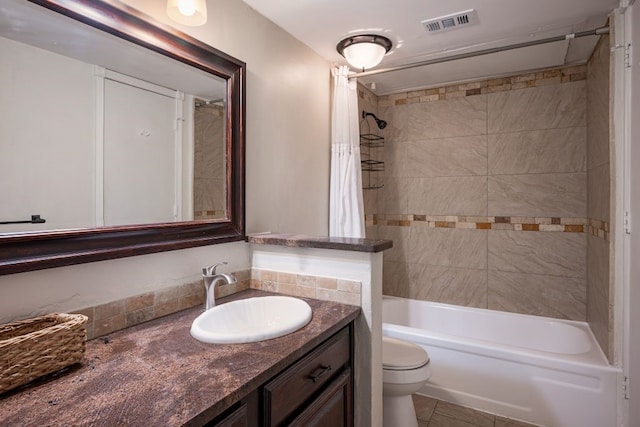 full bathroom featuring vanity, shower / tub combo, toilet, and tile patterned flooring