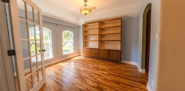 unfurnished room with french doors and hardwood / wood-style floors