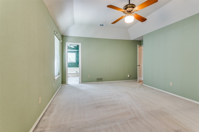 unfurnished room featuring light colored carpet, ceiling fan, and lofted ceiling