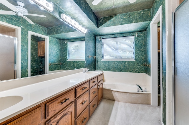 bathroom with vanity, ceiling fan, and plus walk in shower