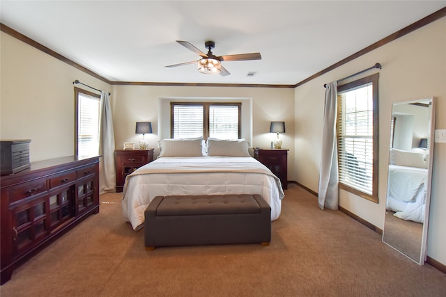 carpeted bedroom featuring ceiling fan, multiple windows, and crown molding