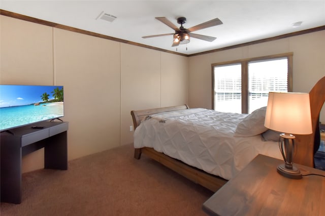 bedroom featuring ceiling fan, carpet floors, and crown molding