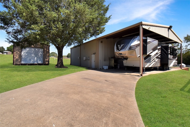 view of side of property with a lawn and a carport