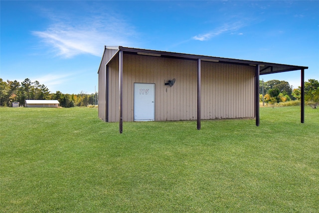 view of outdoor structure featuring a yard