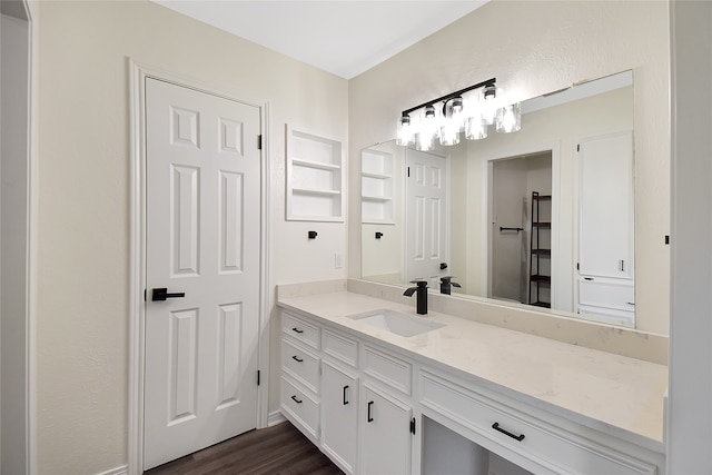 bathroom with vanity and hardwood / wood-style floors