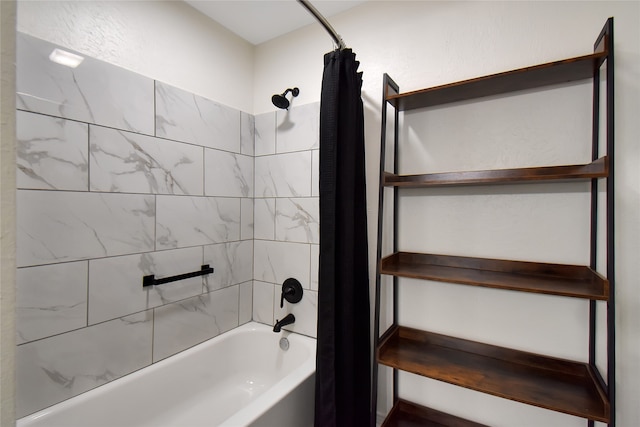 bathroom with shower / bathtub combination with curtain