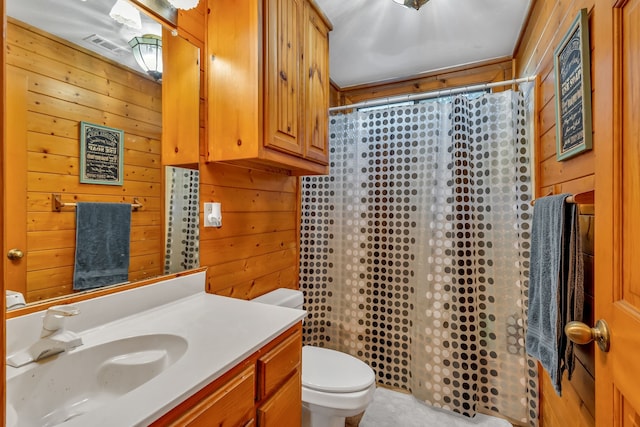 bathroom with vanity, toilet, wood walls, and a shower with curtain