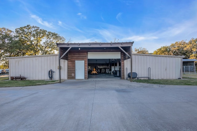 garage with concrete driveway