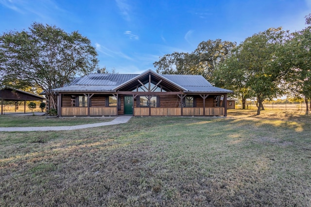 log cabin with a front yard