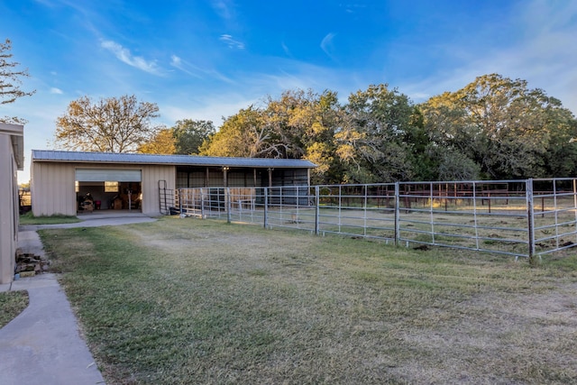 view of stable with a rural view