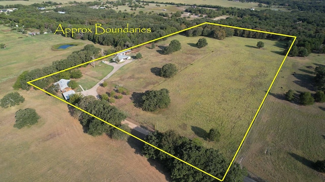 birds eye view of property featuring a rural view