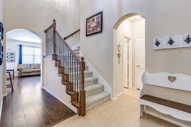 stairs featuring hardwood / wood-style flooring