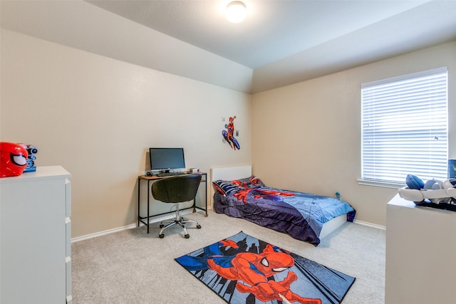 carpeted bedroom with vaulted ceiling