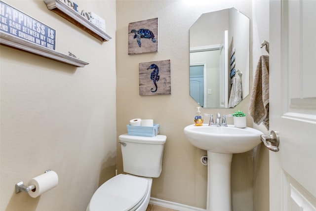 bathroom with toilet and sink