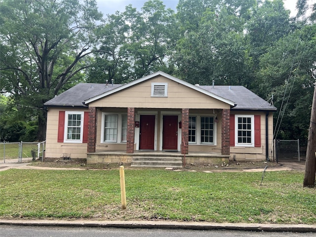 view of front of home featuring a front lawn and covered porch