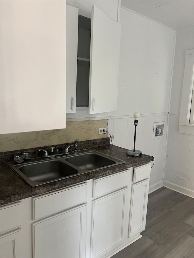 kitchen with white cabinetry, dark wood-type flooring, and sink