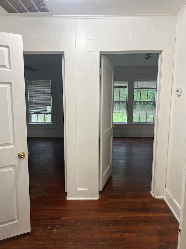 hallway with dark hardwood / wood-style floors