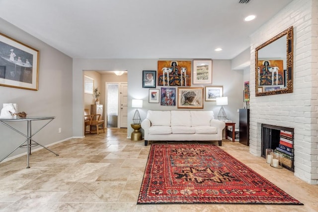 living area featuring recessed lighting, visible vents, a fireplace, and baseboards