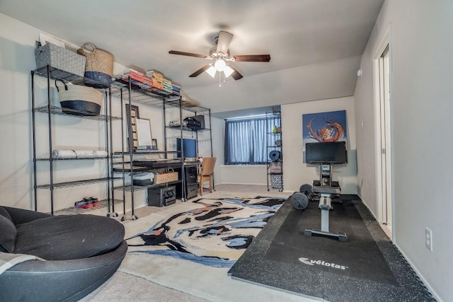 workout room with a ceiling fan