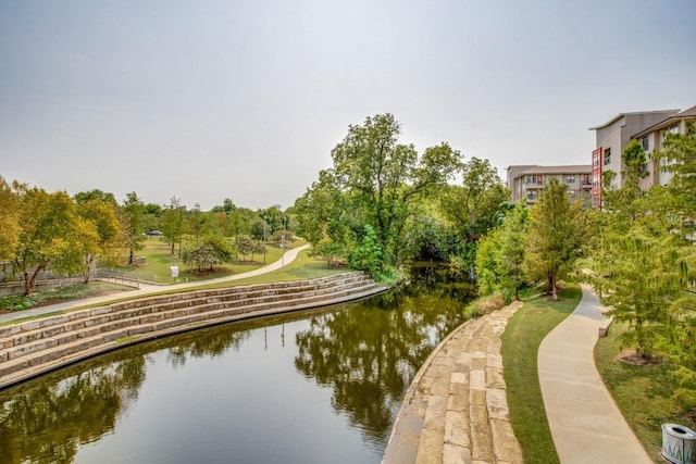 view of community with a water view