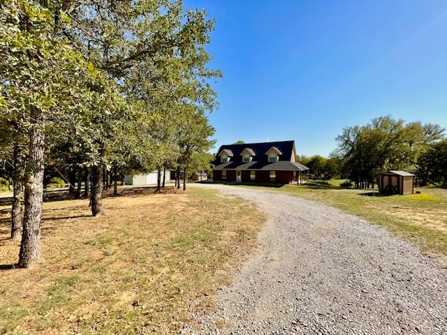 view of front facade with a storage shed