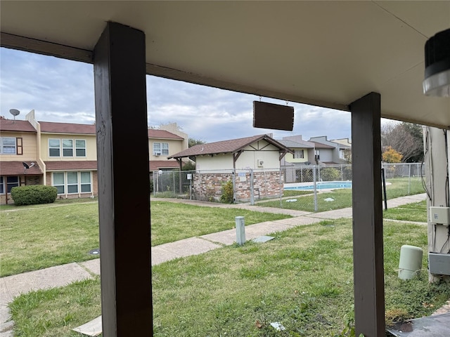 view of yard with a fenced in pool