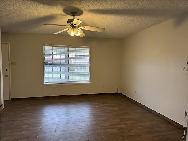 spare room featuring a textured ceiling, dark hardwood / wood-style floors, and ceiling fan