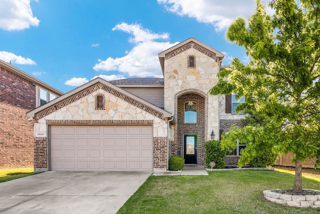 view of front of property with a garage and a front lawn