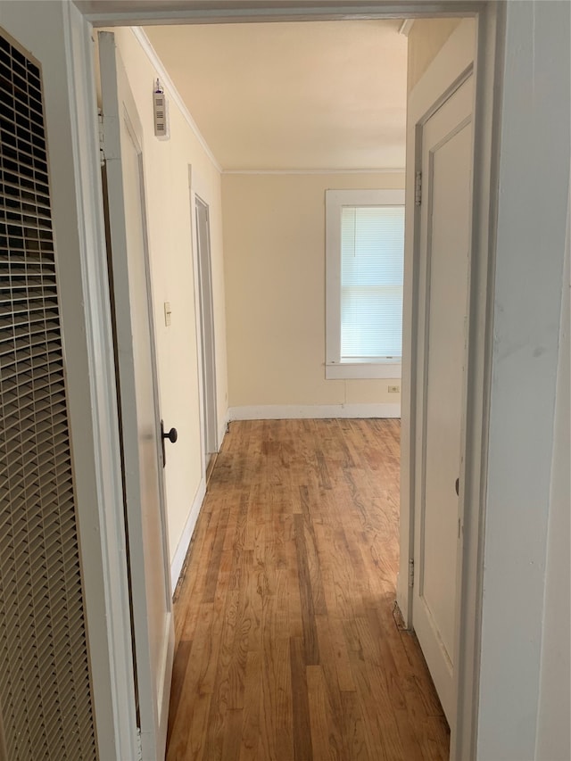 hall with light wood-type flooring