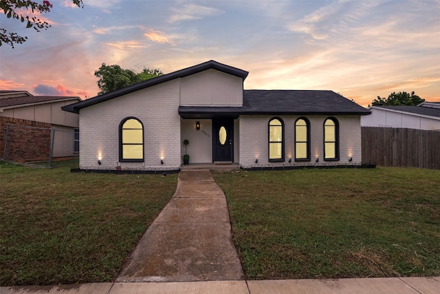 view of front of house with a lawn