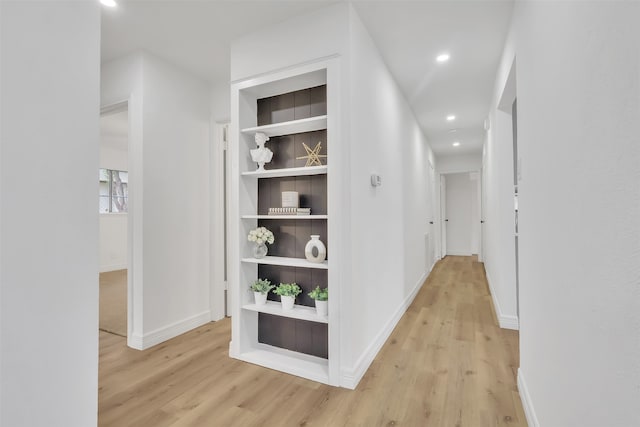 hall with light hardwood / wood-style flooring