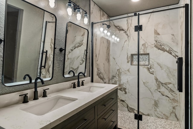 bathroom featuring walk in shower and vanity