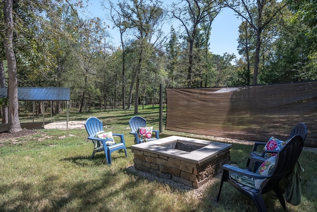 view of yard with an outdoor fire pit