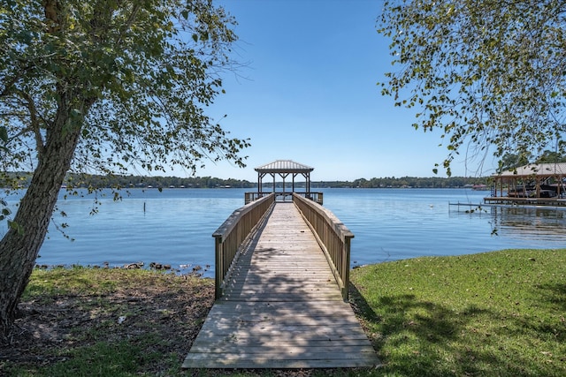 dock area with a gazebo and a water view