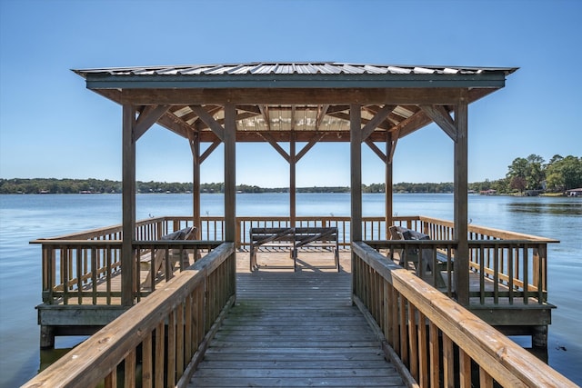 dock area featuring a gazebo and a water view